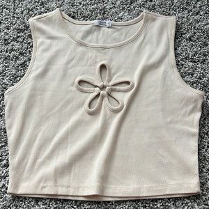 I am selling a small light yellow ribbed flower crop top